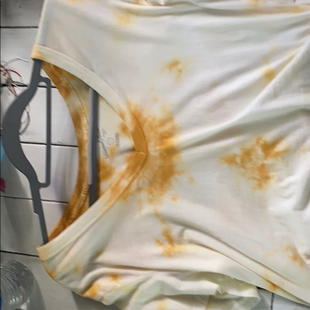 It is a really comfortable yellow tie dye crop top